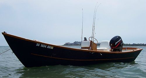 Sweet Caroline home built plywood workboat in the water